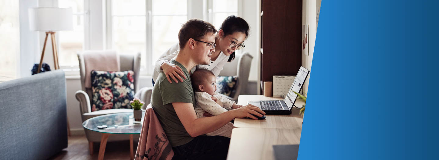 Young family in their living room on viewing their laptop